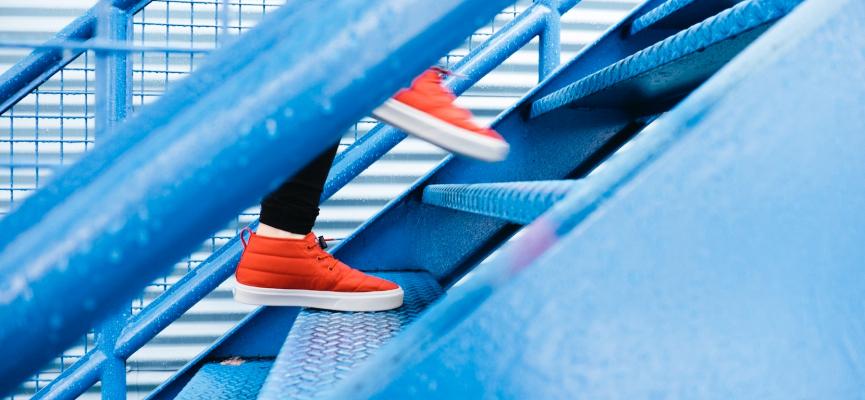 Someone climbing a flight of stairs